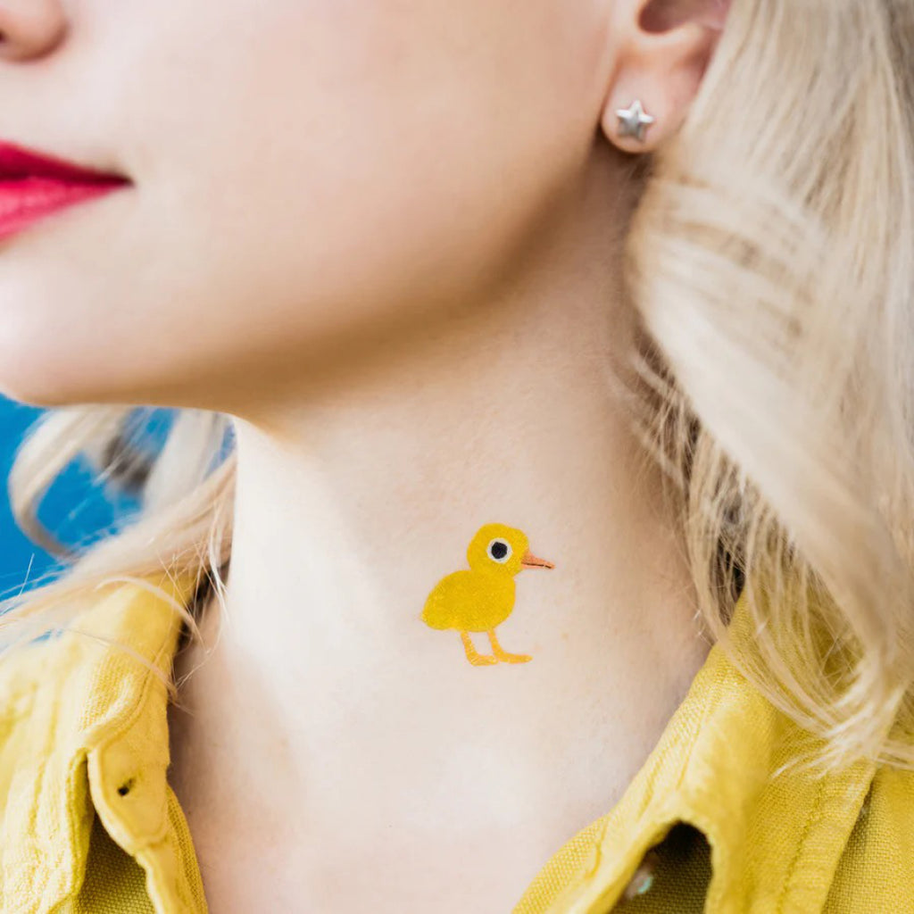 Duckling Tattoo on neck.